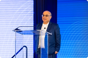 Rohit Arora speaking on stage